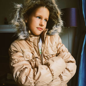 Portrait of girl sitting at home