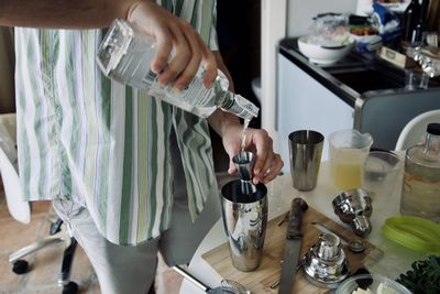 Midsection of man preparing food on table