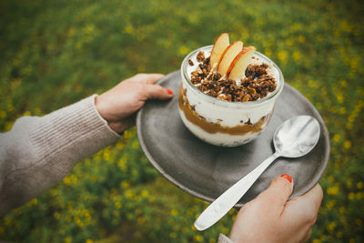 Midsection of person holding ice cream cone