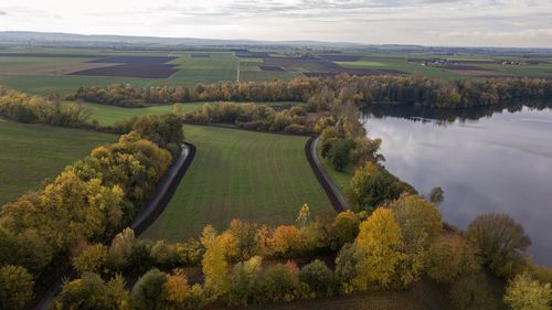 Scenic view of agricultural landscape against sky