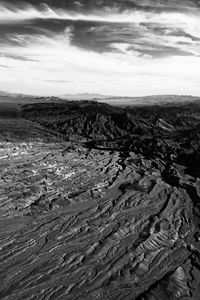 Scenic view of barren landscape against sky