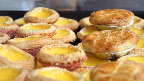 Close-up of hong kong macao iconic egg tarts and pineapple pie pastry sweet dessert