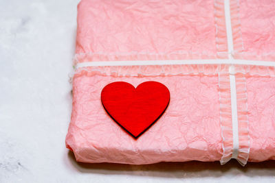 Close-up of heart shape on pink fabric