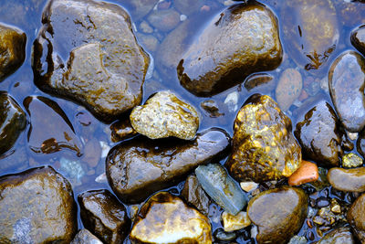 Full frame shot of stones in water