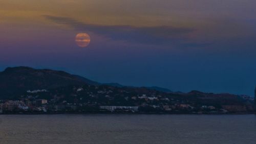 Scenic view of sea against sky at night