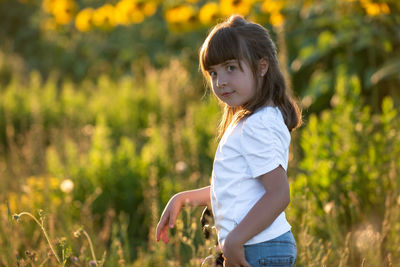 Girl standing on field