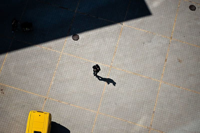 High angle view of shadow on person in city