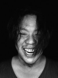 Close-up portrait of a smiling young man