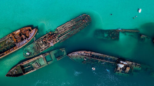 Aerial view of abandoned ships in sea