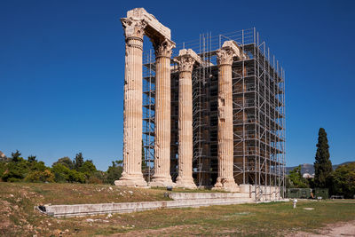 Low angle view of building against clear blue sky