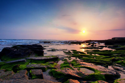 Scenic view of sea against sky during sunset