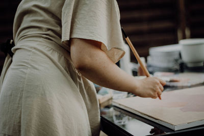 Midsection of man working at home