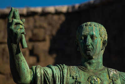 Statue of marco coceyo nerva in brass, street via dei fori imperiali. rome, italy