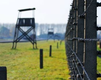 Close-up of chainlink fence on field