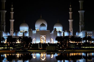 Night view on illuminated marble domes of grand mosque