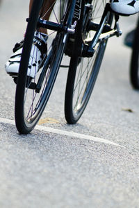 Low section of bicycle parked on road