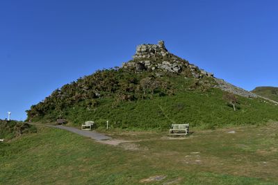 Scenic view of land against clear blue sky