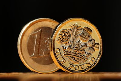 Close-up of coins on black background