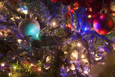 Close-up of illuminated christmas tree at night