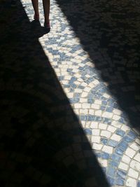 Low section of people standing on footpath