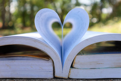 Close-up of heart shape on book