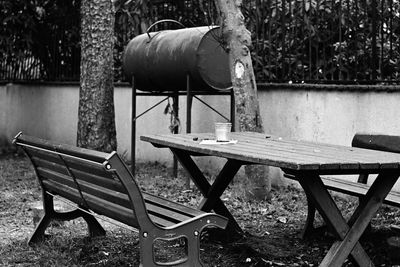 Empty chairs and tables in yard