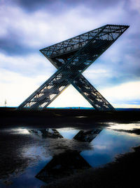 Bridge over river against sky