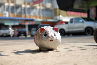 Close-up of toy on road in city