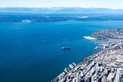 High angle view of sea and buildings in city