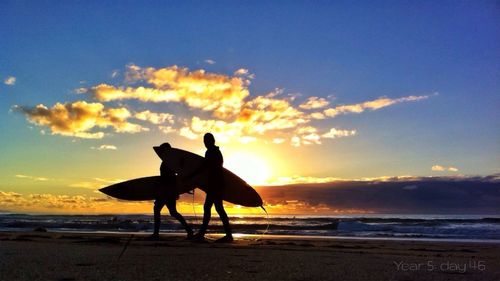 Scenic view of beach at sunset