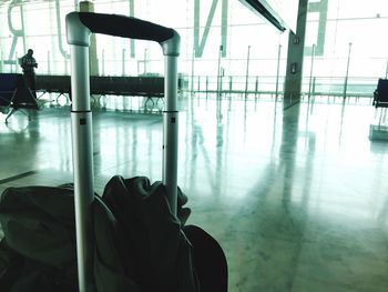 Close-up of suitcase on floor at airport