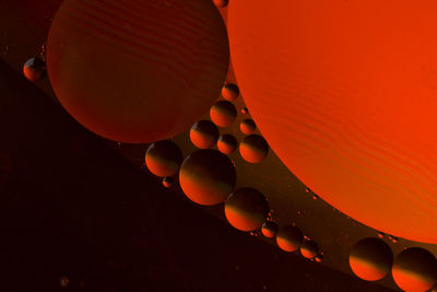 High angle view of balloons against orange sky