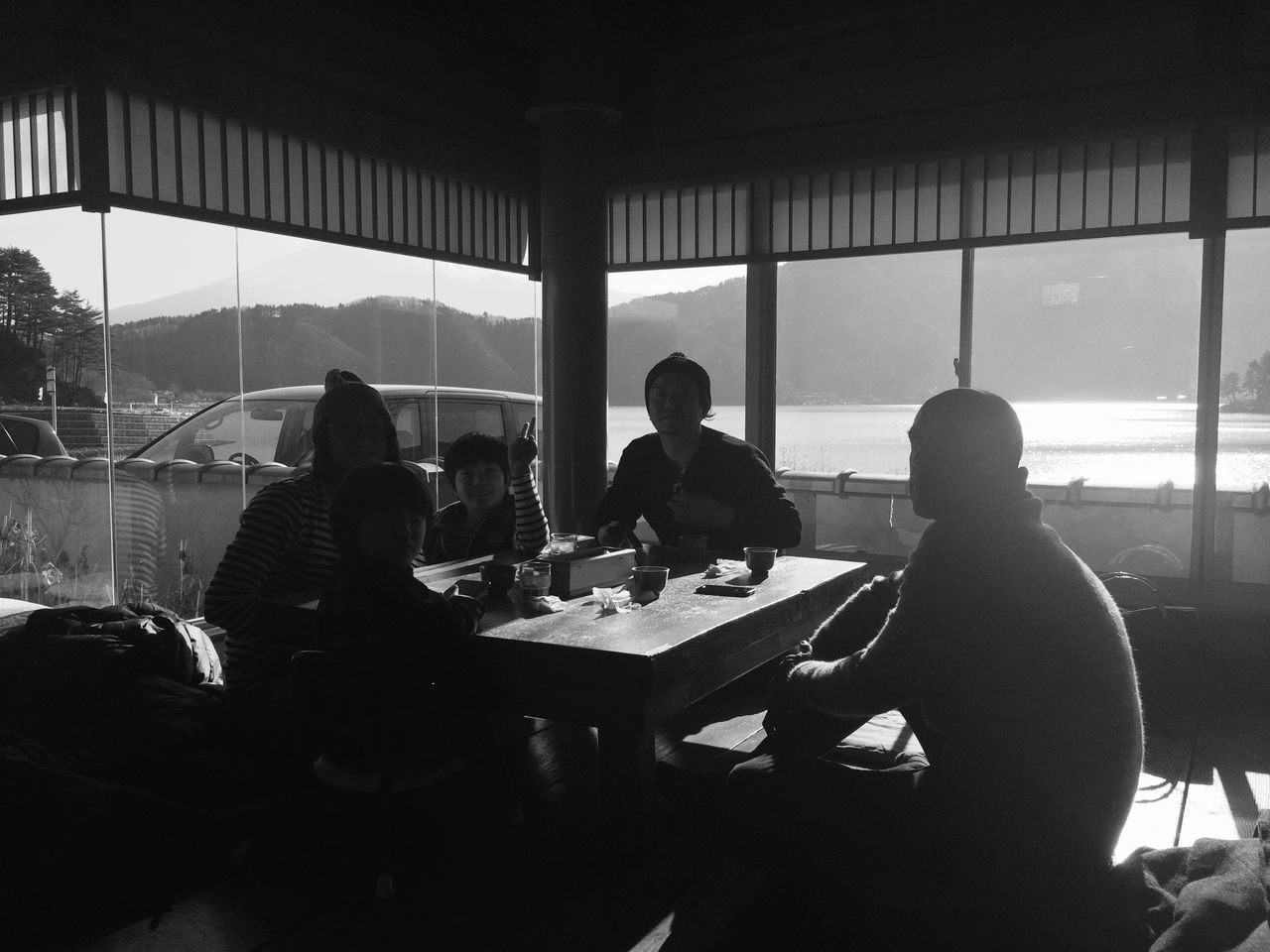 window, indoors, men, table, real people, day, sitting, togetherness, friendship, women, architecture, sky, people