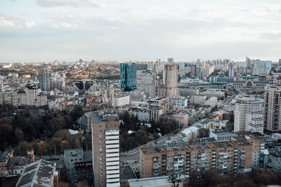 High angle view of buildings in city against sky