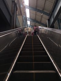 People walking on escalator