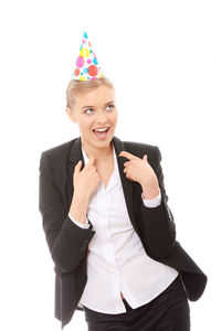 Portrait of a smiling young woman against white background