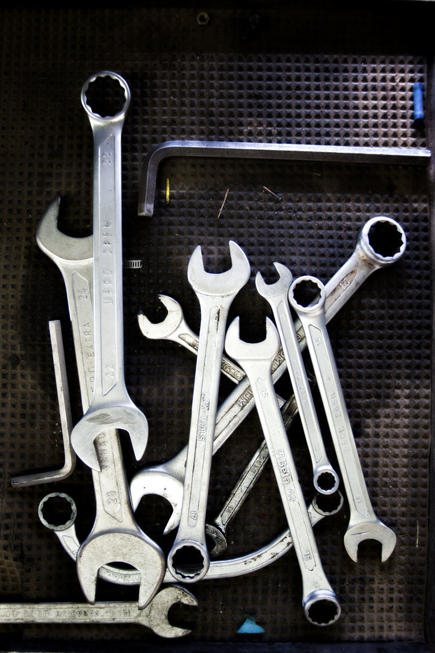 HIGH ANGLE VIEW OF TOOLS ON METAL