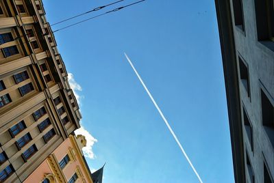 Low angle view of buildings against blue sky