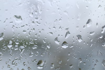 Full frame shot of wet glass window