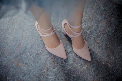 Low section of woman standing on ground