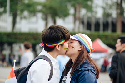 Young woman wearing multi colored outdoors