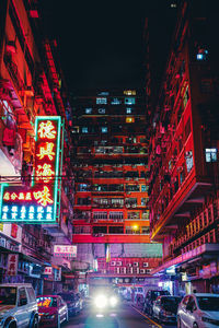 Illuminated city street at night