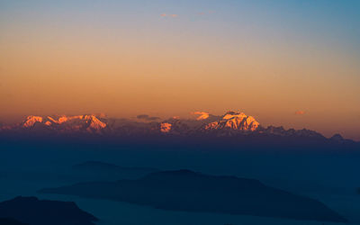 Scenic view of mountains against sky during sunset