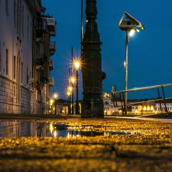 Low angle view of illuminated street light at night