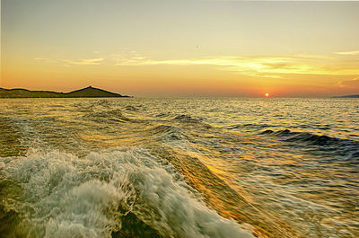 Scenic view of sea against sky during sunset