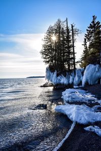 Scenic view of sea against sky during winter