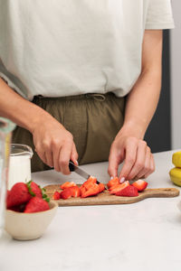 Midsection of man preparing food