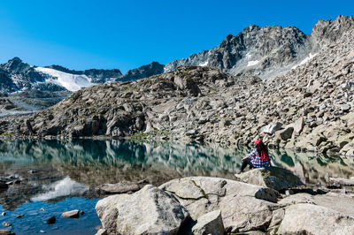 Scenic view of snowcapped mountains against clear blue sky