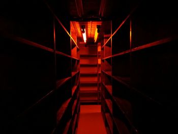 Illuminated escalator at night