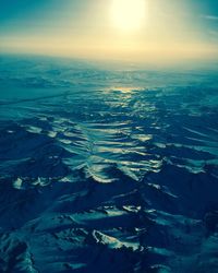 Aerial view of landscape against sky during winter